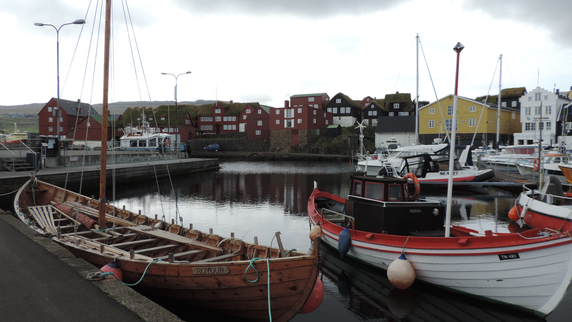 modern viking boat on old harbour