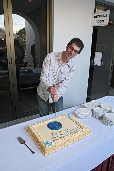Michael Lawley, preparing himself physically and mentally for cutting a sponge cake,  | DSTC Farewell Symposium, 28 July 2005  | 