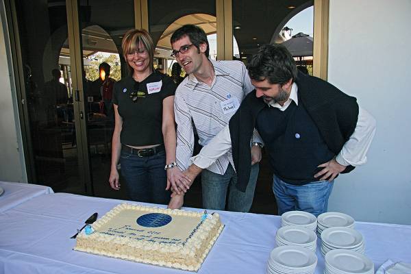 Naomi Andrew, Michael Lawley, Zoran Milosevic,  | the sponge cake is finally defeated by their combined efforts,  | DSTC Farewell Symposium, 28 July 2005  | 