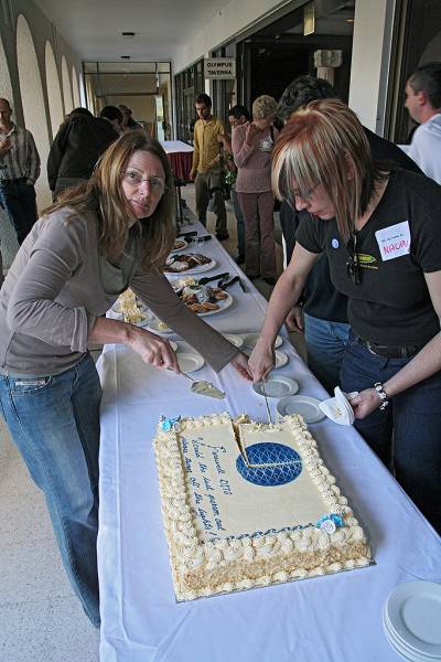 Liz Armstrong, Naomi Andrew, cutting the cake,  | DSTC Farewell Symposium, 28 July 2005  | 