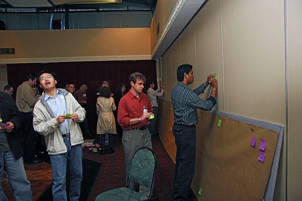 Dawei Song, Paul Newbound, Vargees Paramasamy,  | working on the DSTC timeline,  | DSTC Farewell Symposium, 28 July 2005  | 