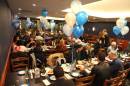Everyone sitting down to eat 