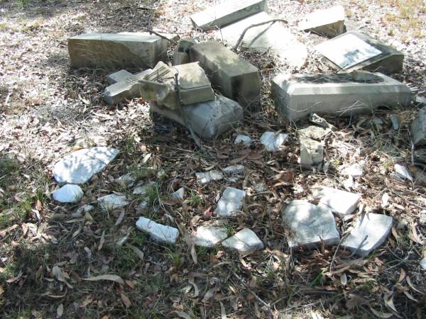 [Smashed headstones];  | Goodna General Cemetery, Ipswich.  | 