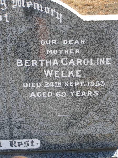 Wilhelm Friedrich WELKE,  | husband father,  | died 22 July 1951 aged 69 years 11 months;  | Bertha Caroline WELKE,  | mother,  | died 24 Sept 1953 aged 69 years;  | Meringandan cemetery, Rosalie Shire  | 
