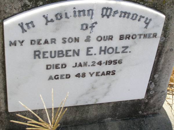 Reuben E. HOLZ,  | son brother,  | died 24 Jan 1956 aged 48 years;  | Milbong St Luke's Lutheran cemetery, Boonah Shire  | 