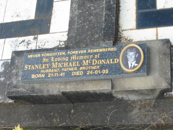 Stanley Angus MCDONALD,  | husband father,  | died 11 July 1959 aged 56 years;  | Florence May MCDONALD,  | mother,  | died 24 June 1988 aged 77 years;  | Stanley Michael MCDONALD,  | husband father brother,  | born 21-11-41,  | died 24-01-05;  | Murwillumbah Catholic Cemetery, New South Wales  | 