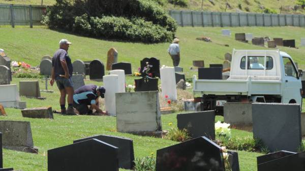 war grave removal of concrete surrounds for grass on Norfolk Island cemetery  | 