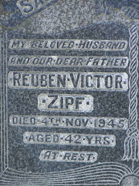Reuben Victor ZIPF,  | husband father,  | died 4 Nov 1945 aged 42 years;  | Winifred Mona ZIPF,  | wife mother,  | died 21 Mar 1993 aged 84 years;  | Pimpama Island cemetery, Gold Coast  | 