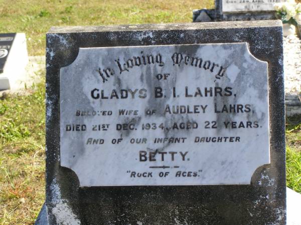 Gladys B.I. LAHRS,  | wife of Audley LAHRS,  | died 21 Dec 1934 aged 22 years;  | Betty,  | infant daughter;  | Pimpama Island cemetery, Gold Coast  | 