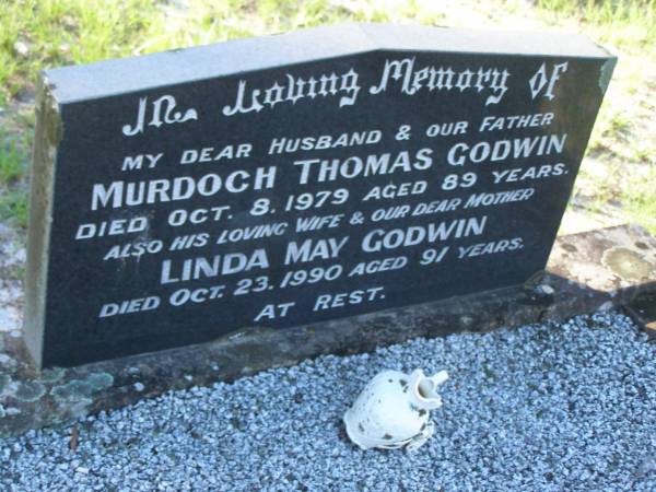 Murdoch Thomas GODWIN,  | husband father,  | died 8 Oct 1979 aged 89 years;  | Linda May GODWIN,  | wife mother,  | died 23 Oct 1990 aged 91 years;  | Tea Gardens cemetery, Great Lakes, New South Wales  | 