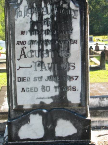 Agustus PAULUS, wife mother,  | died 5 June 1937 aged 60 years;  | Mary PAULUS, daughter sister,  | died 6 May 1930 aged 30 years;  | John PAULUS, father,  | died 18 Aug 1951 aged 91 years;  | Woodford Cemetery, Caboolture  | 