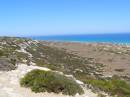 Rocky hillsides lead down to the Great Australian Bight, Nullarbor Plain, Eyre Highway, South Australia 